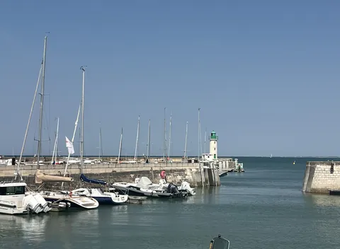 La Flotte harbour, sailing boats and the green pier lighthouse