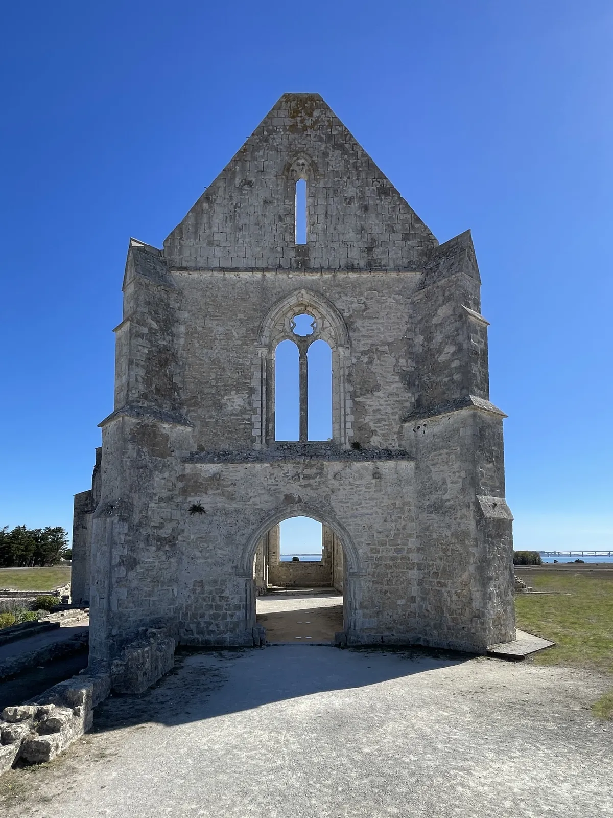 The Châteliers abbey in La Flotte, stone gable against a blue sky