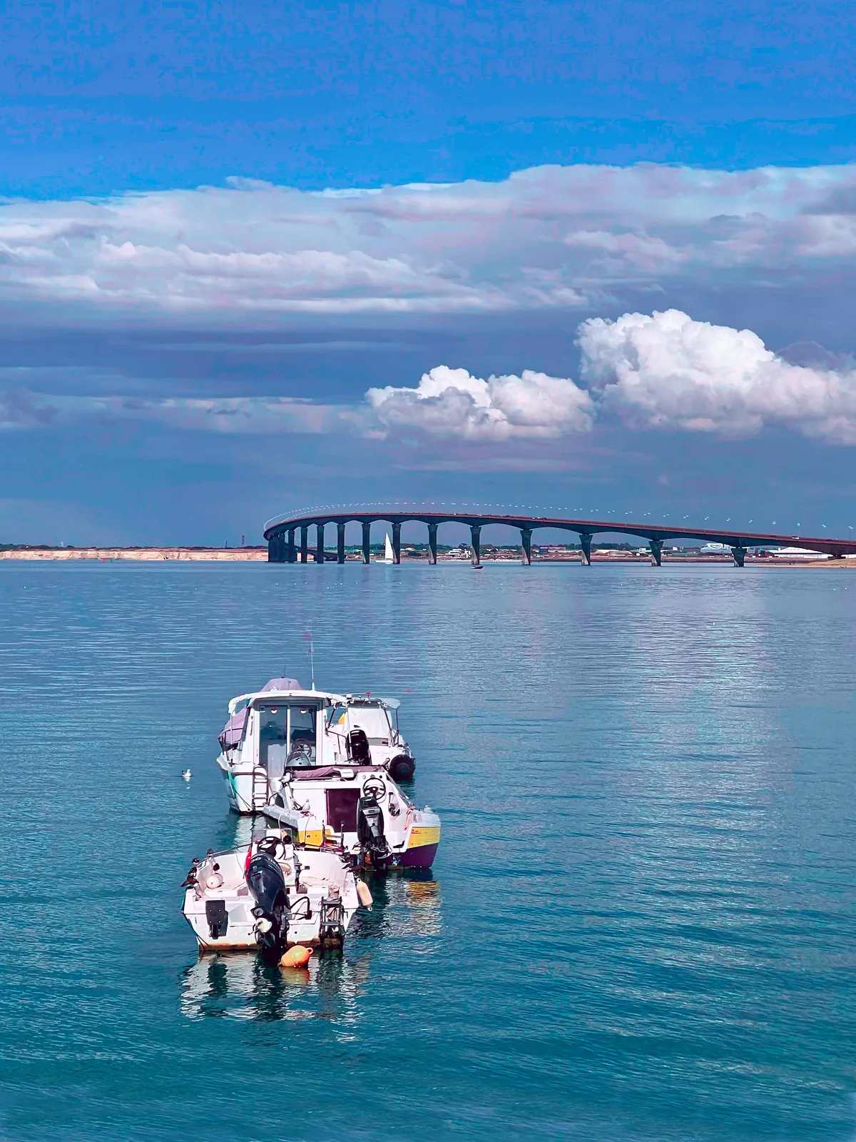 Fishing boats at Rivedoux-Plage with the Île de Ré bridge behind