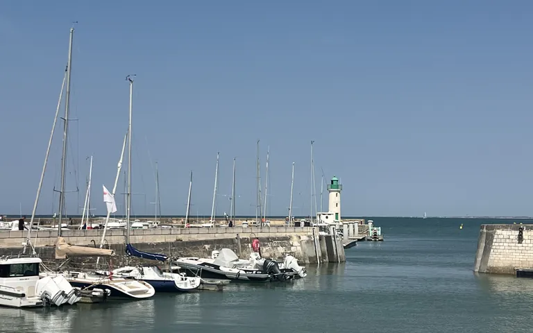 La Flotte harbour, sailing boats and the green pier lighthouse